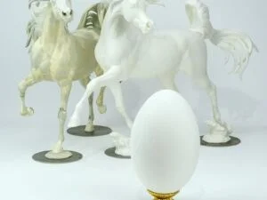 Egg next to Model Horses