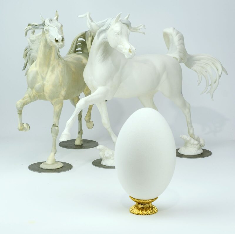Egg next to Model Horses